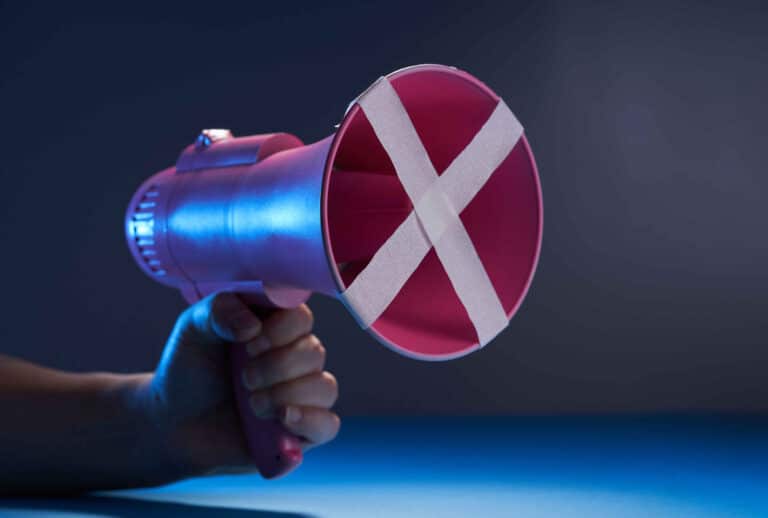 megaphone with crossed tape - free to speak