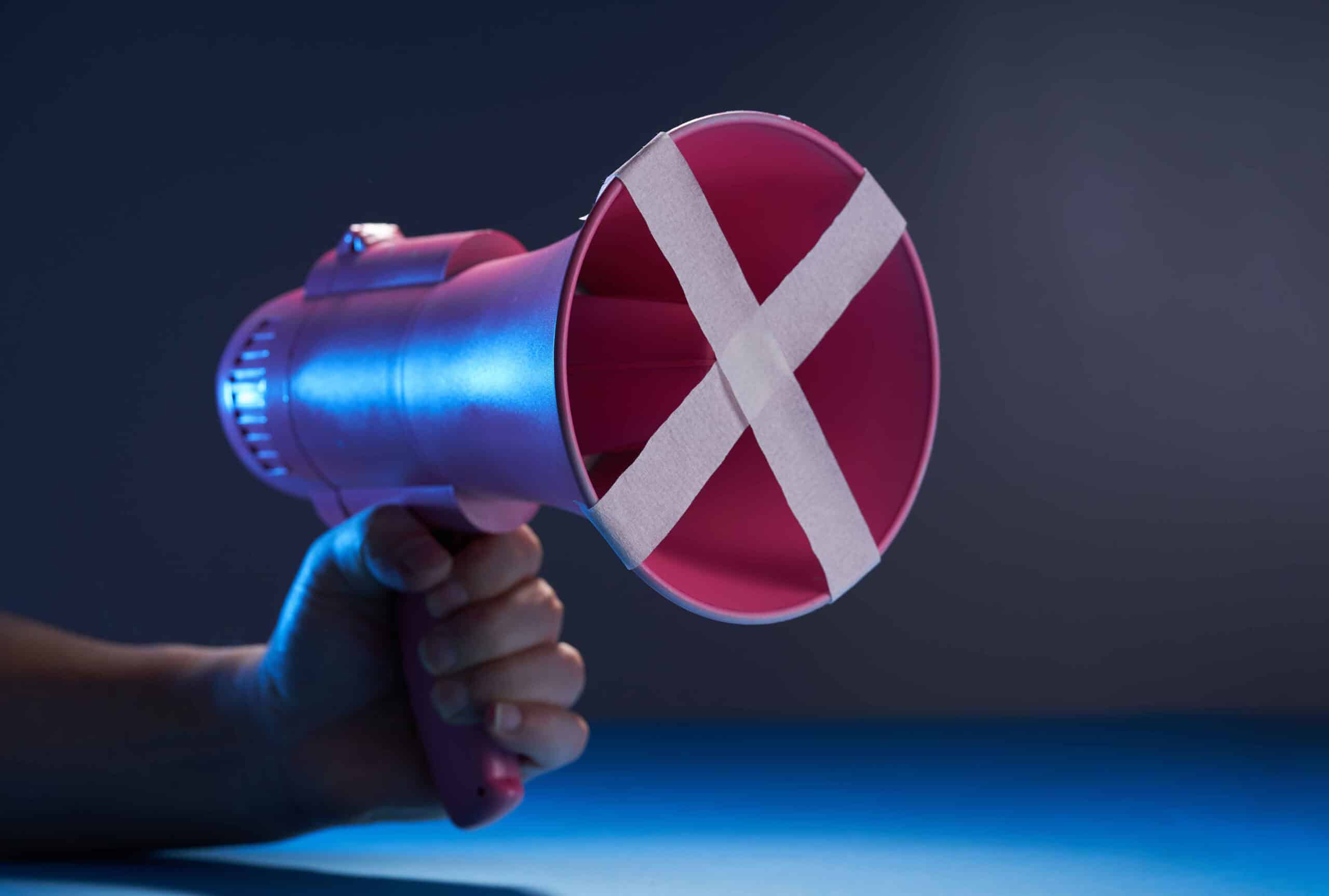 megaphone with crossed tape - free to speak